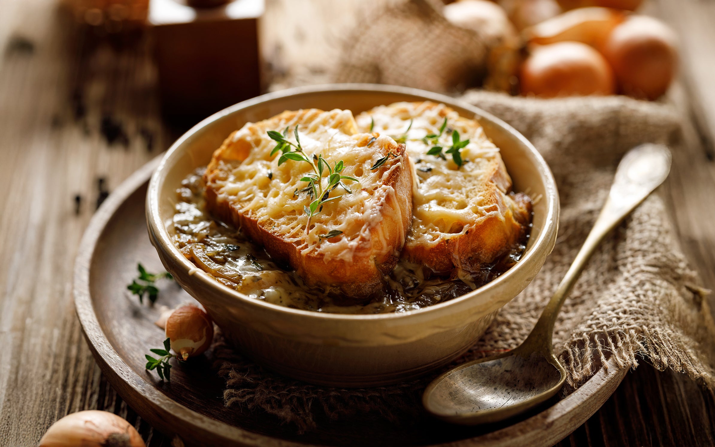 An Egyptian walking onion soup recipe; the soup is in a bowl on a table