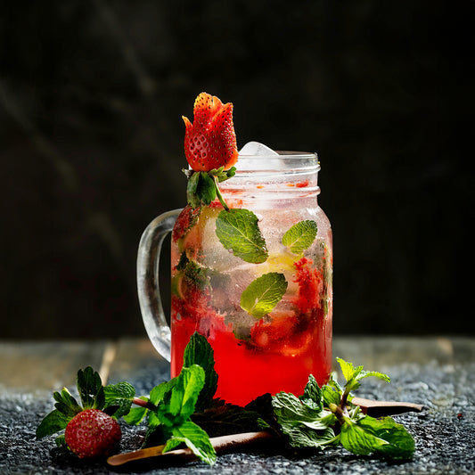 Strawberry mint in an iced tea with strawberries